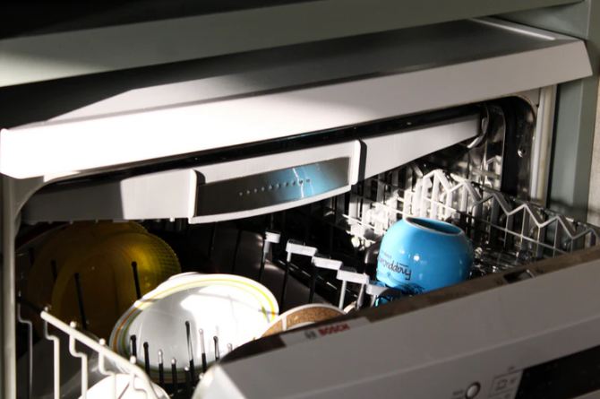 plates and mug in a dishwasher