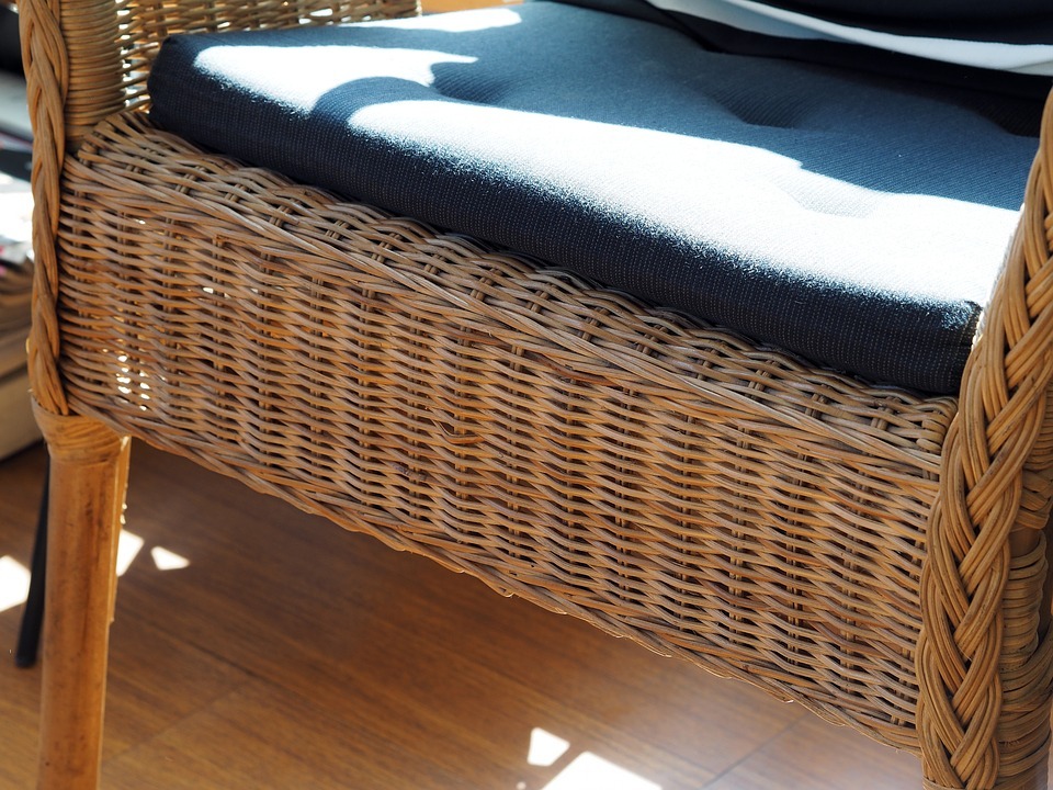 a close up of a rattan seat cushion on a rattan chair