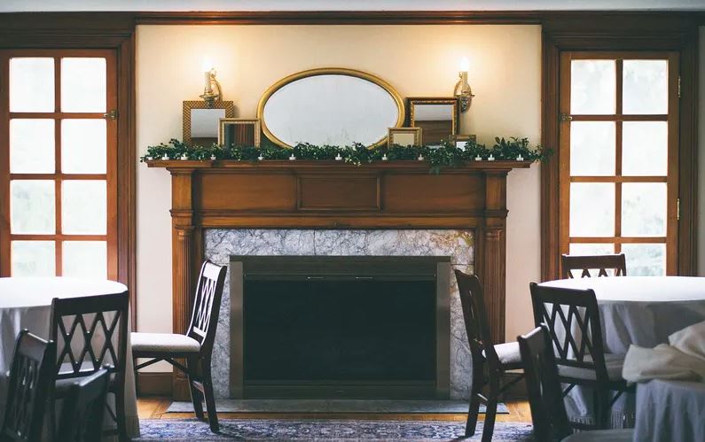 A group of mirrors displayed as a mantel décor