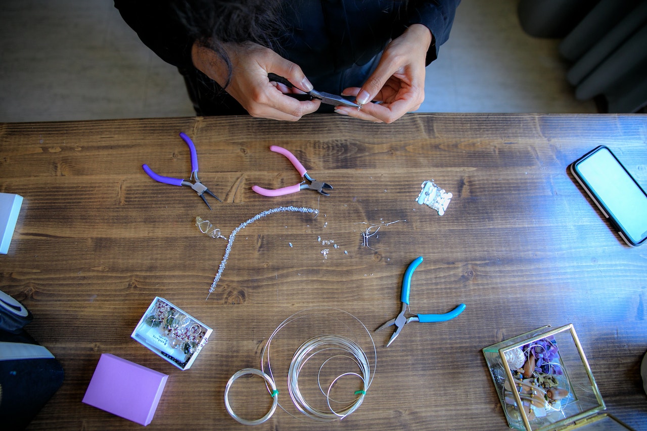 top view of a worktable with different jewelry making tools