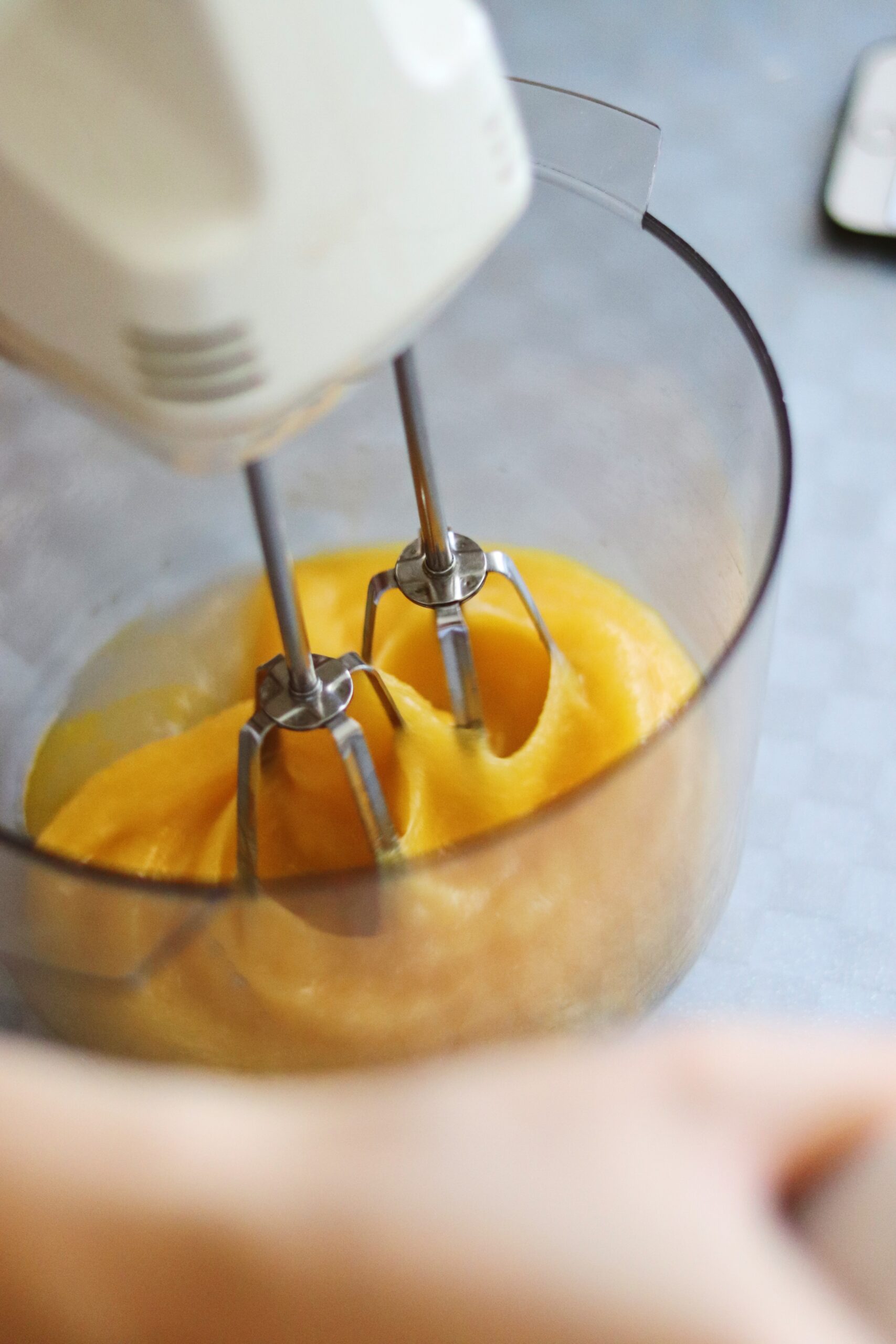 mixing raw eggs in a bowl