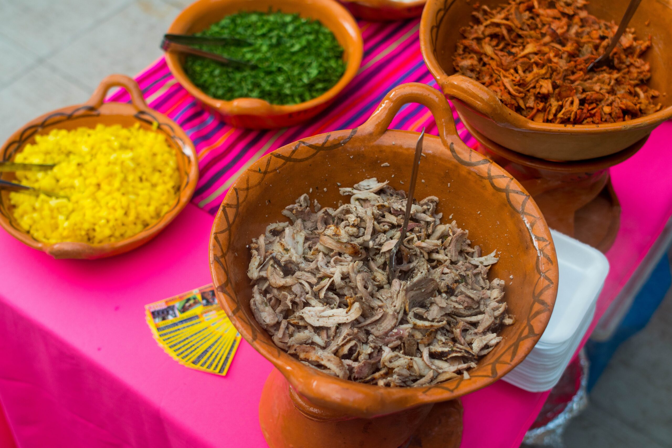 shredded meat on clay bowls