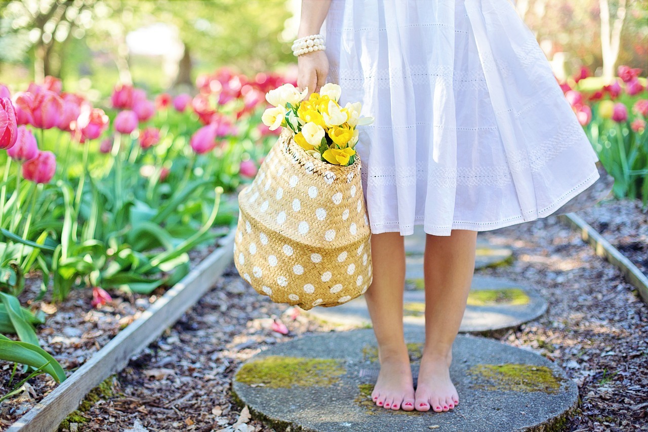 woman carrying basket of flowers