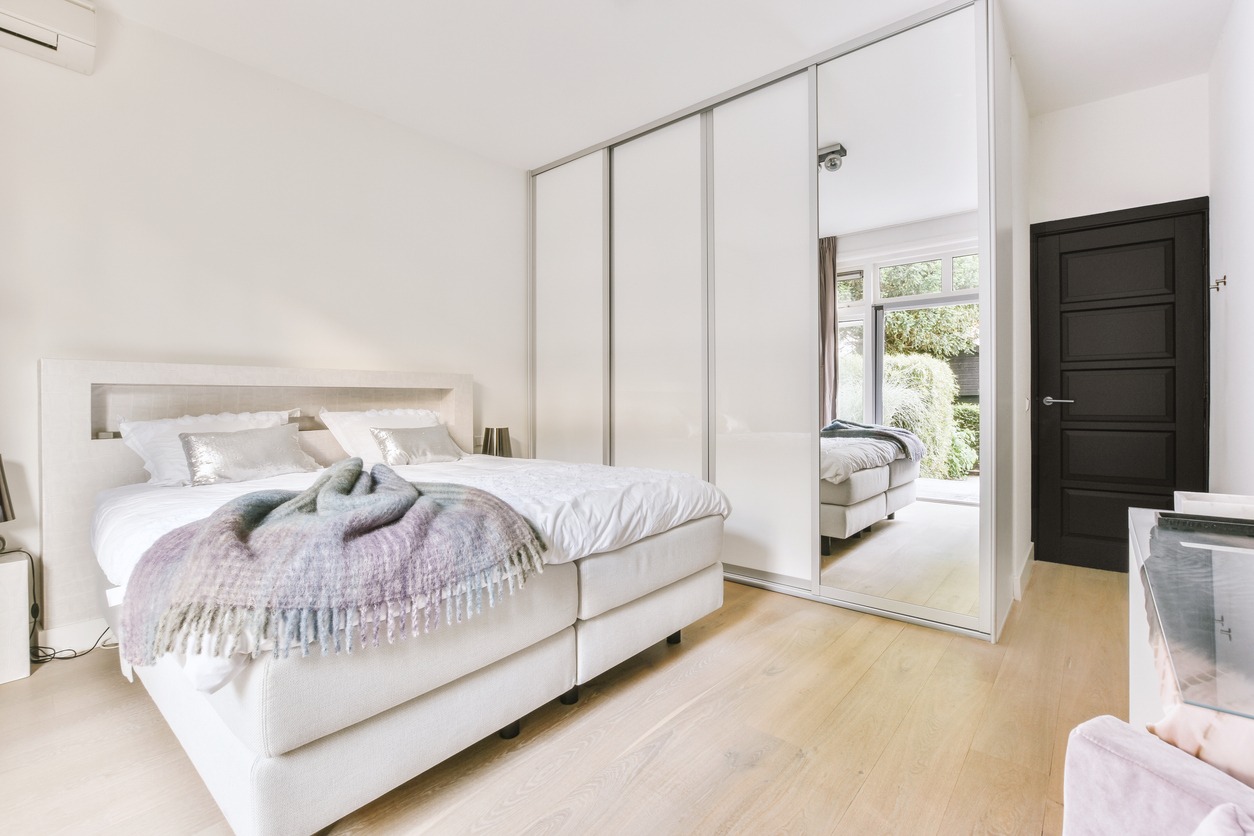 closet with mirror in a bedroom