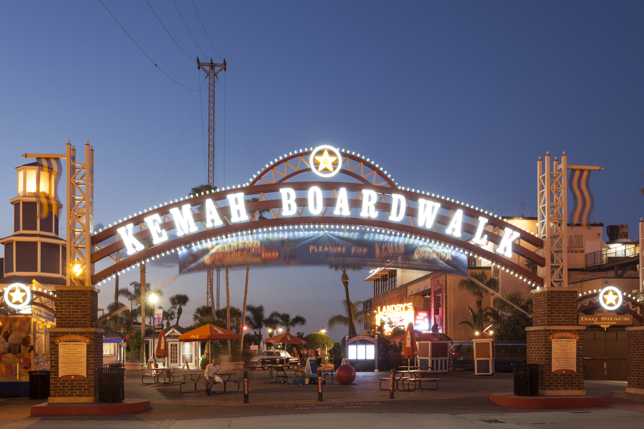 Kemah Boardwalk entrance arch illuminated at night