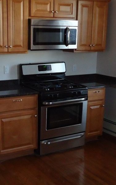 a kitchen with an oven and a microwave