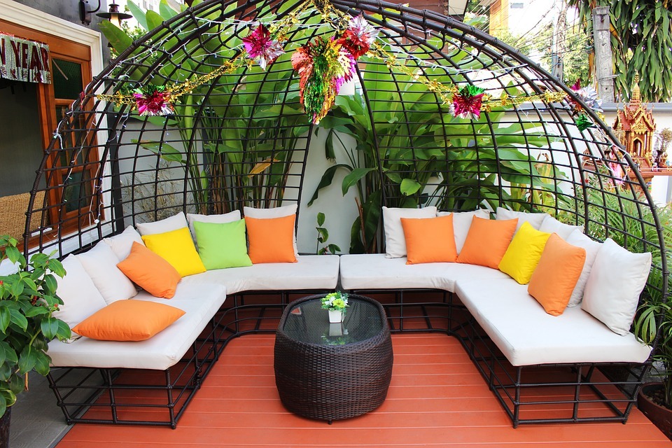 White modern patio furniture with bright pillows