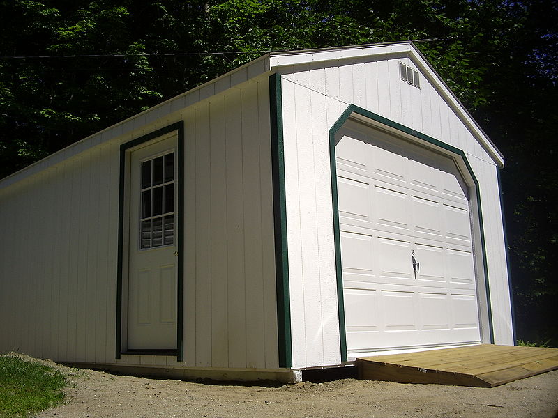 a wooden detached garage