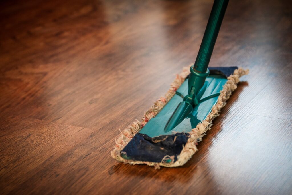 cleaning a brown wooden floor