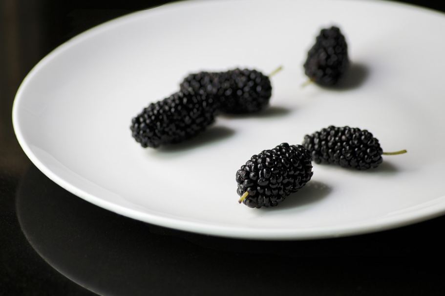 black mulberry fruits in a plate