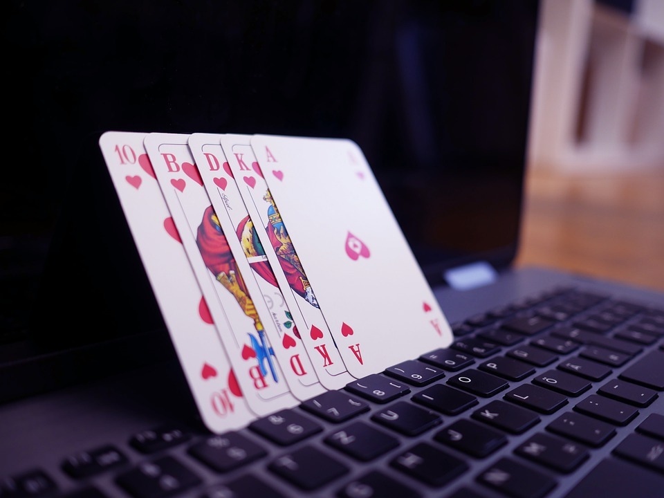 cards on top of a laptop