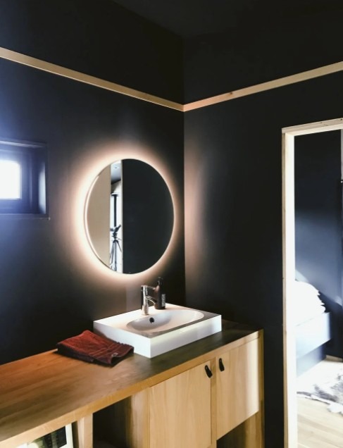 a silvered mirror with LED light in the bathroom
