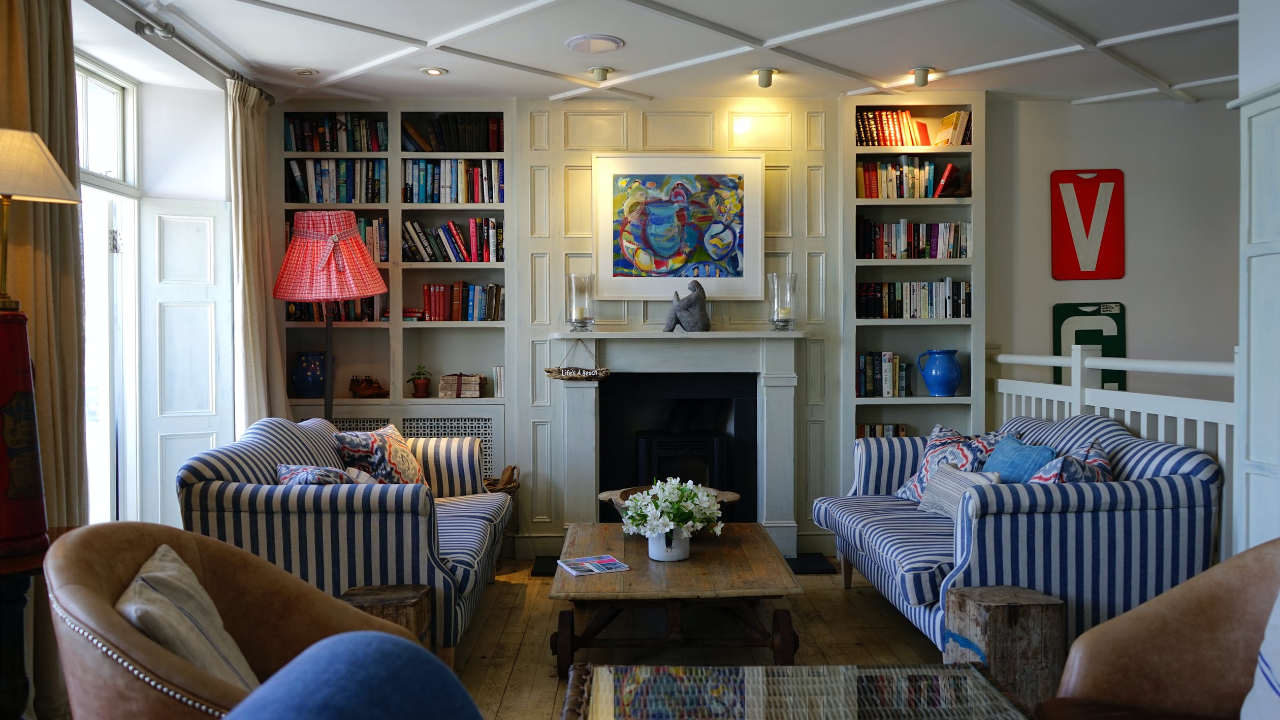 Bookshelves with sofas and a lamp