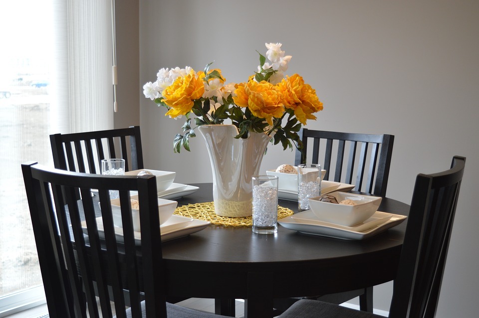 Keep the dining table arranged at all times for minimizing clutter.