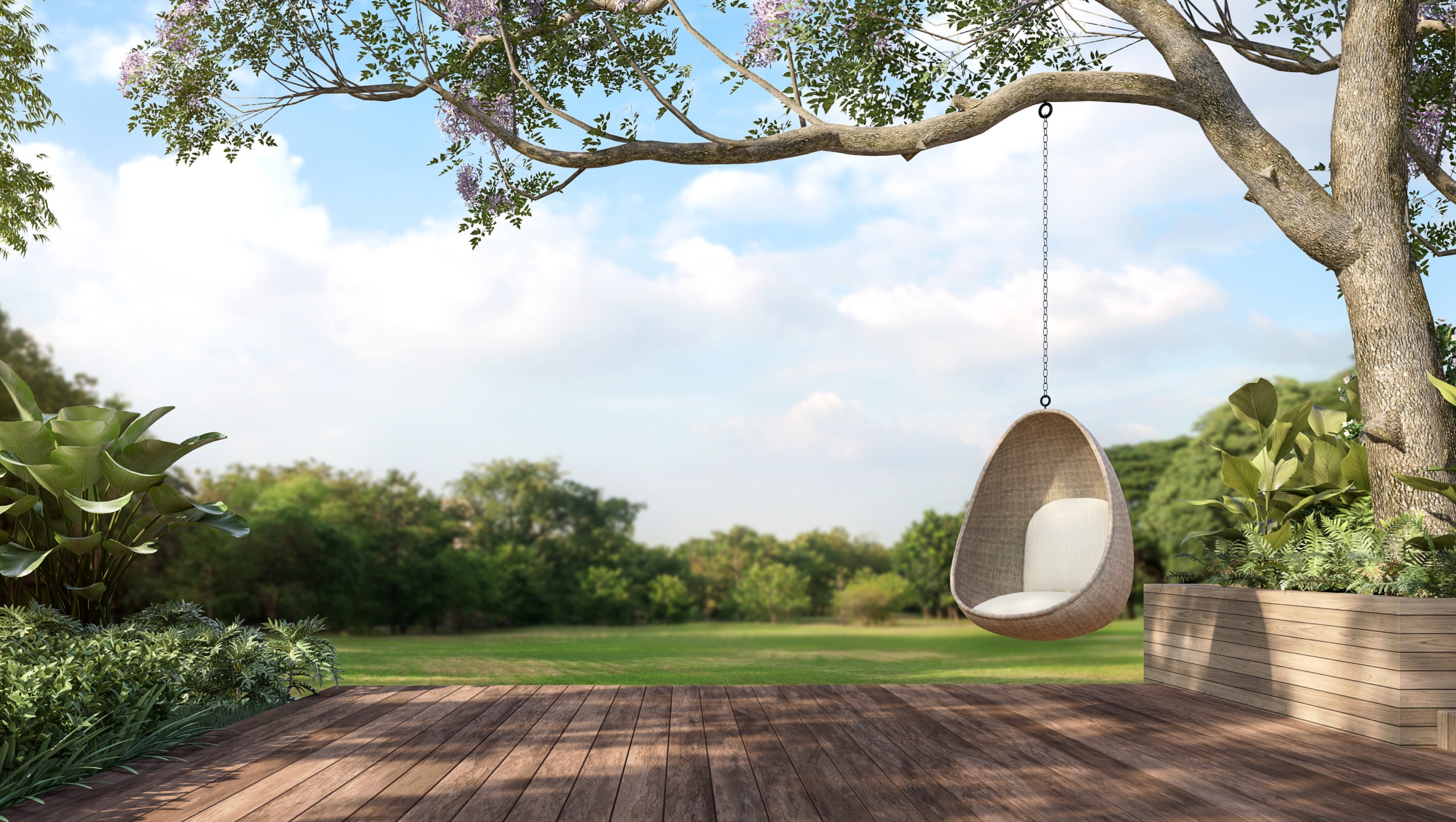 wooden outdoor relaxation area with a rattan hammock hanging on a tree