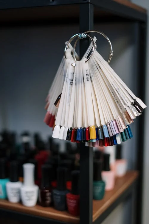 hanging different colors of nail polish 