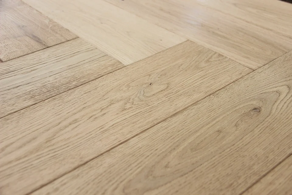 Vinyl plank flooring installed in a herringbone pattern