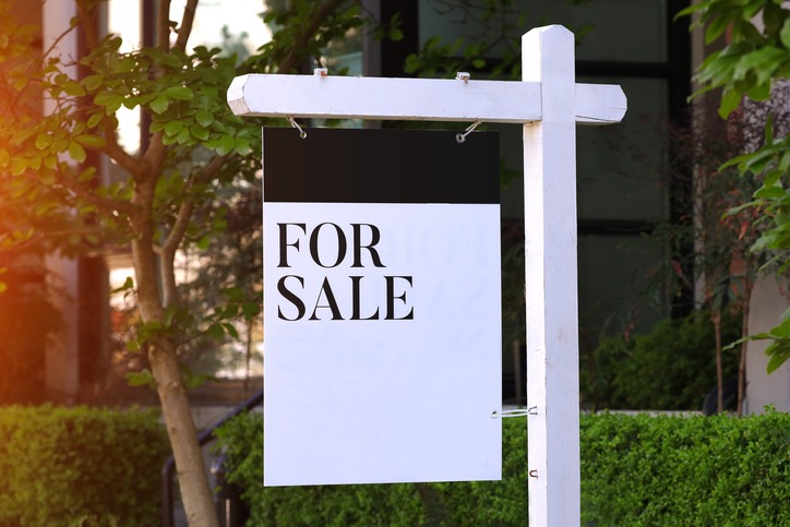 Real estate development for sale sign listing white black website