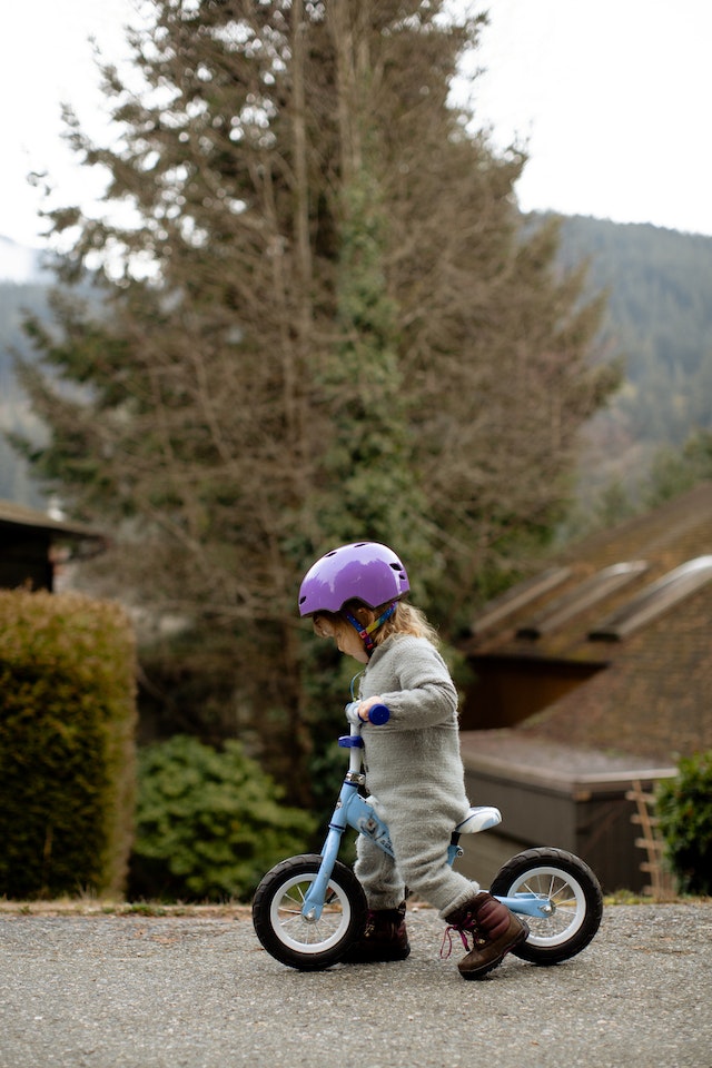 little girl on a little bike