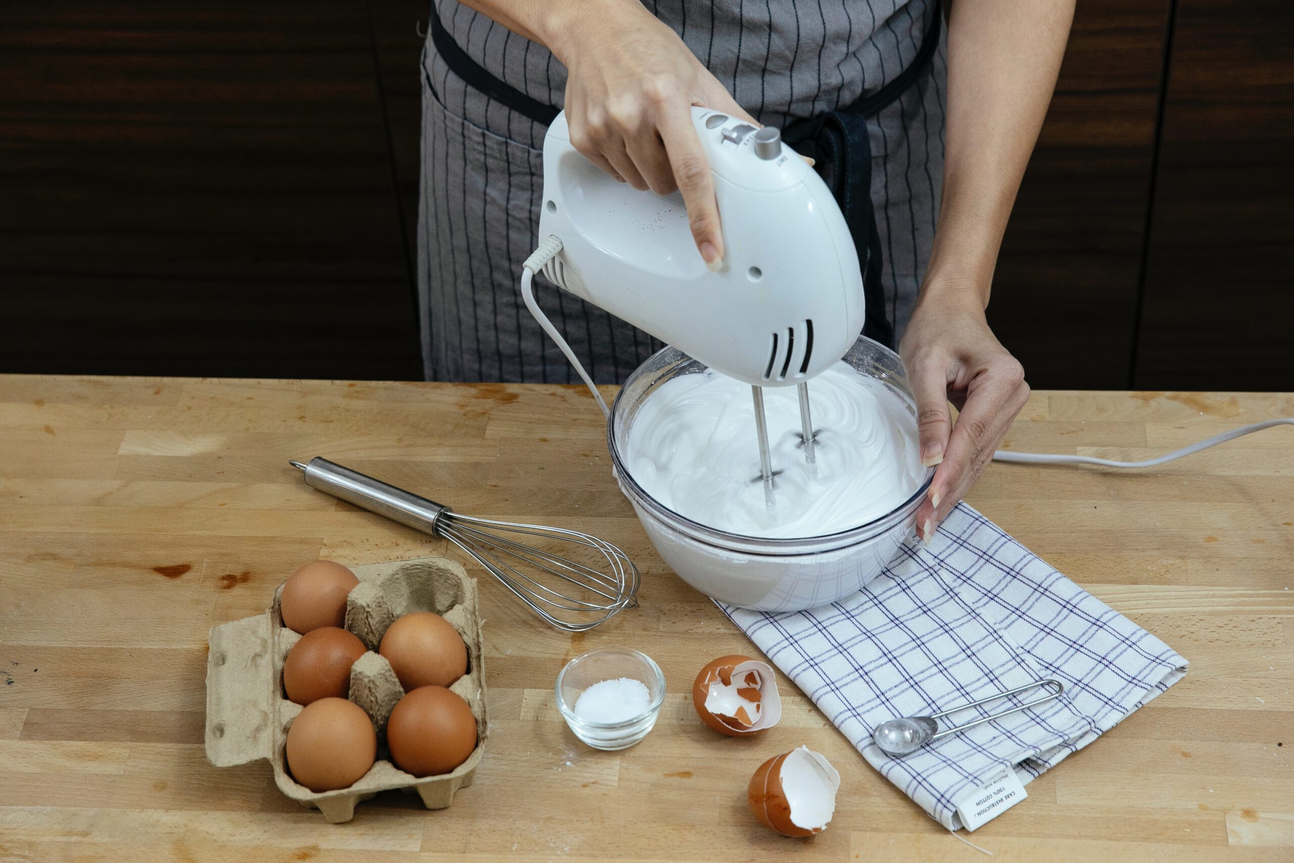 woman beating eggs with mixer